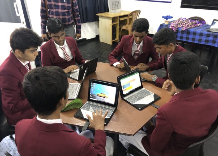Students at a Sri Lankan school KSE has supported, learning on laptops